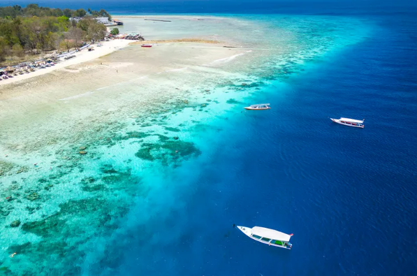 Aerial view of Gili Trawangan reef and turquoise water, Indonesia